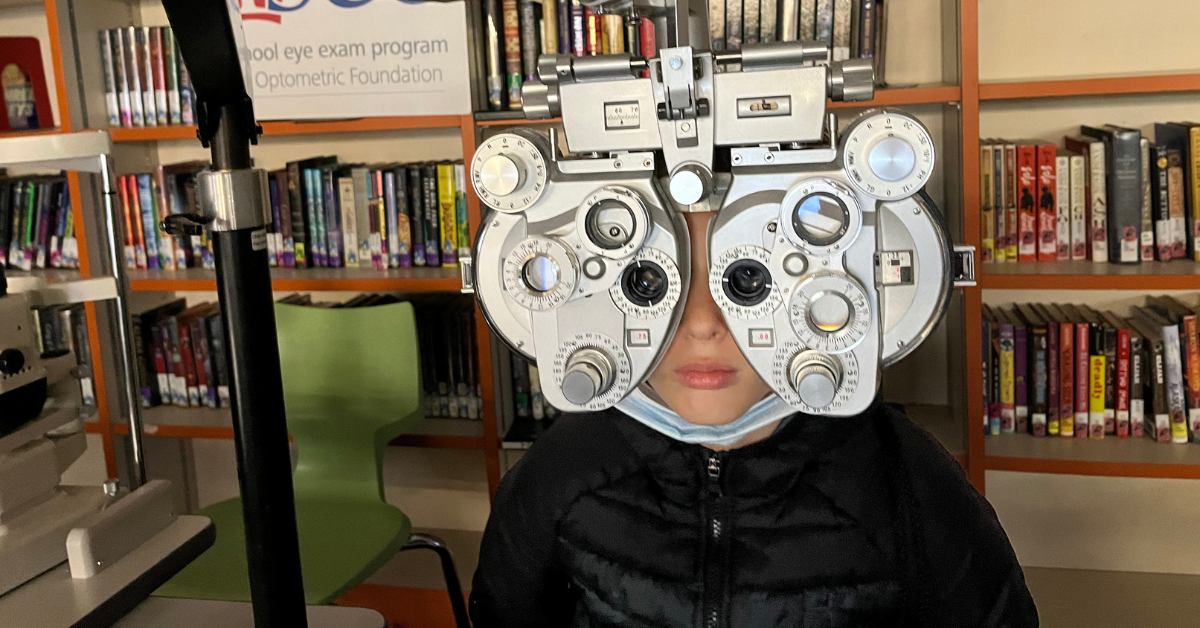 student sitting eyecare chair